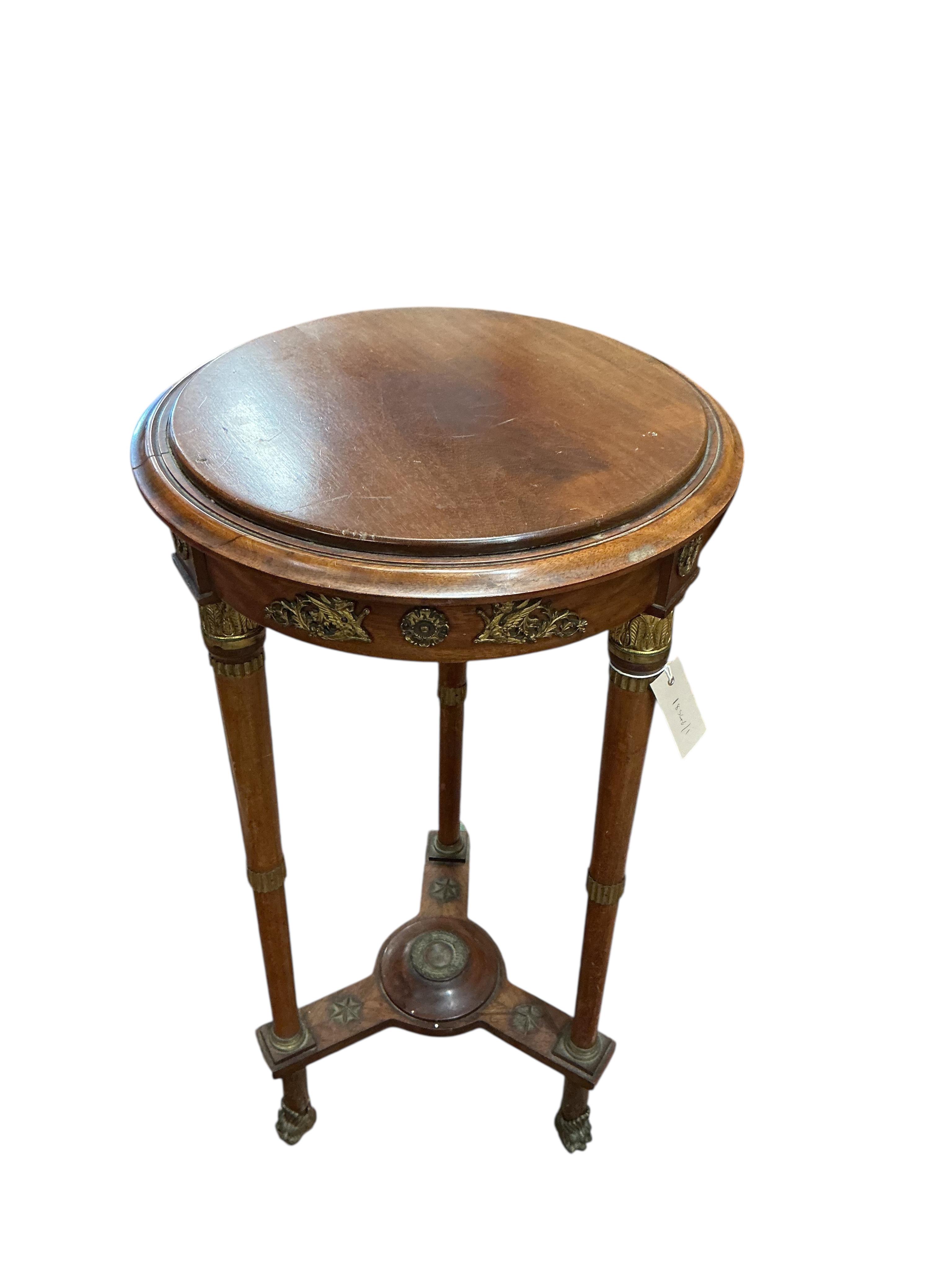 An empire style gilt metal mounted mahogany gueridon table